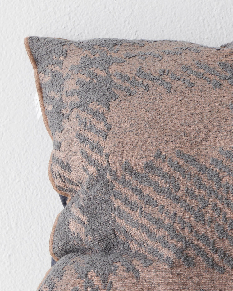 Sienne Dusk cushion close-up, 50x50cm, showing oversized check texture in mauve and faded denim-blue with overlocked edge by Weave Home