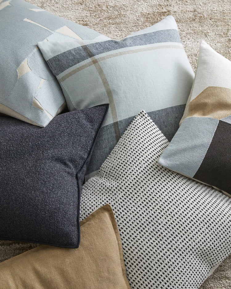 Dante Laurel 50x50 cushion in natural linen check with charcoal and taupe stripes, displayed with coordinating textiles by Weave Home