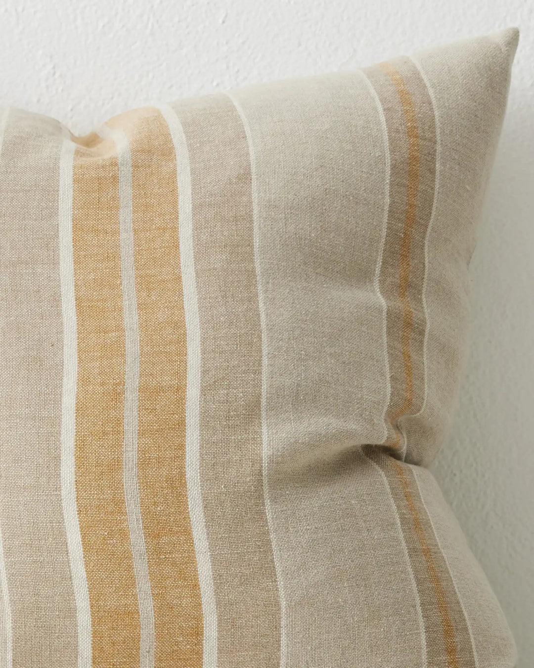 Franco Linen cushion detail view showing yellow, grey and white striped linen with white piping, 50x50cm by Weave Home