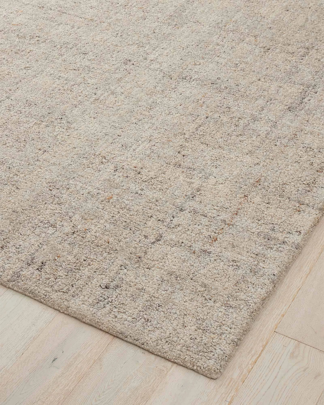 Marceau Fox wool blend rug in grey, corner detail showing textured weave with contrasting light and dark threads, by Weave Home