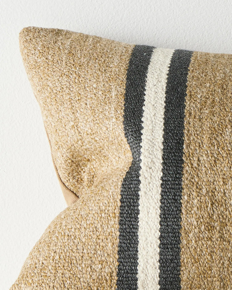 Mila Desert lumbar cushion close-up, wool-linen blend in sand with charcoal and cream stripe detail by Weave Home
