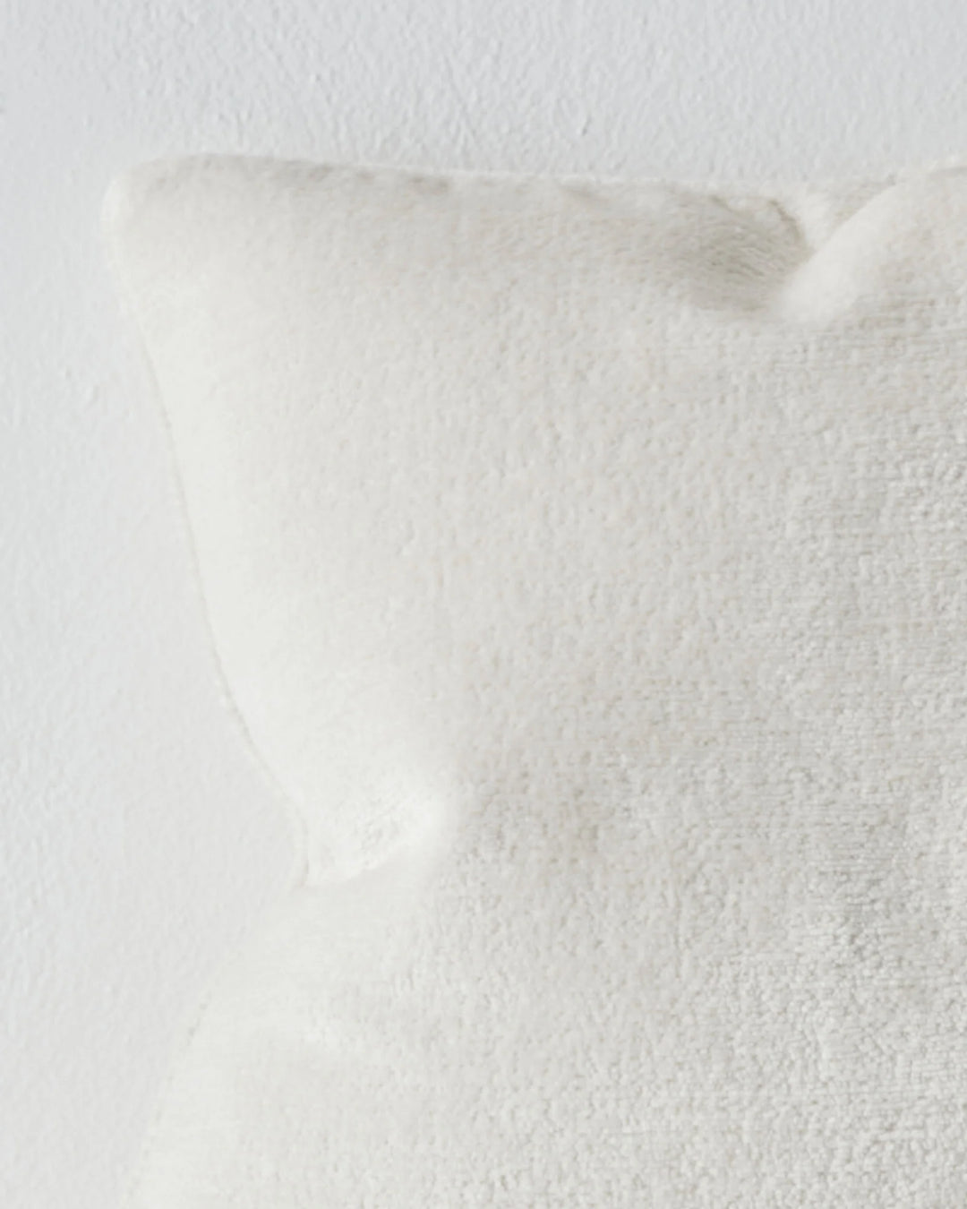 Tempo Pearl 50x50 cushion close-up, showing chunky chenille texture and piped edge detail in pristine white by Weave Home