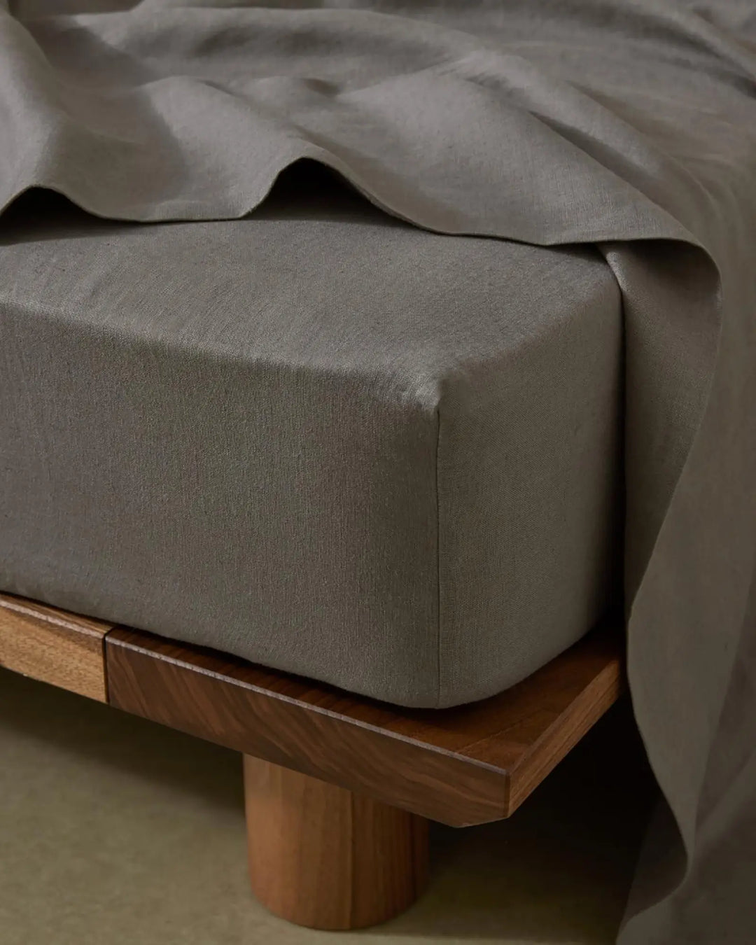 Ravello Fitted Sheet in charcoal, European linen with deep pocket, shown close-up detail by Weave Home