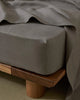 Ravello Fitted Sheet in charcoal, European linen with deep pocket, shown close-up detail by Weave Home