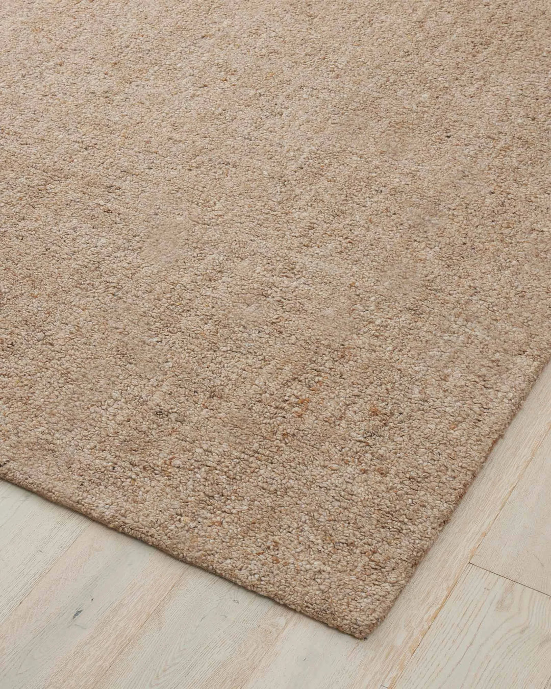 Marceau Taupe wool-blend rug corner detail, showing warm brown texture and hand-woven construction by Weave Home