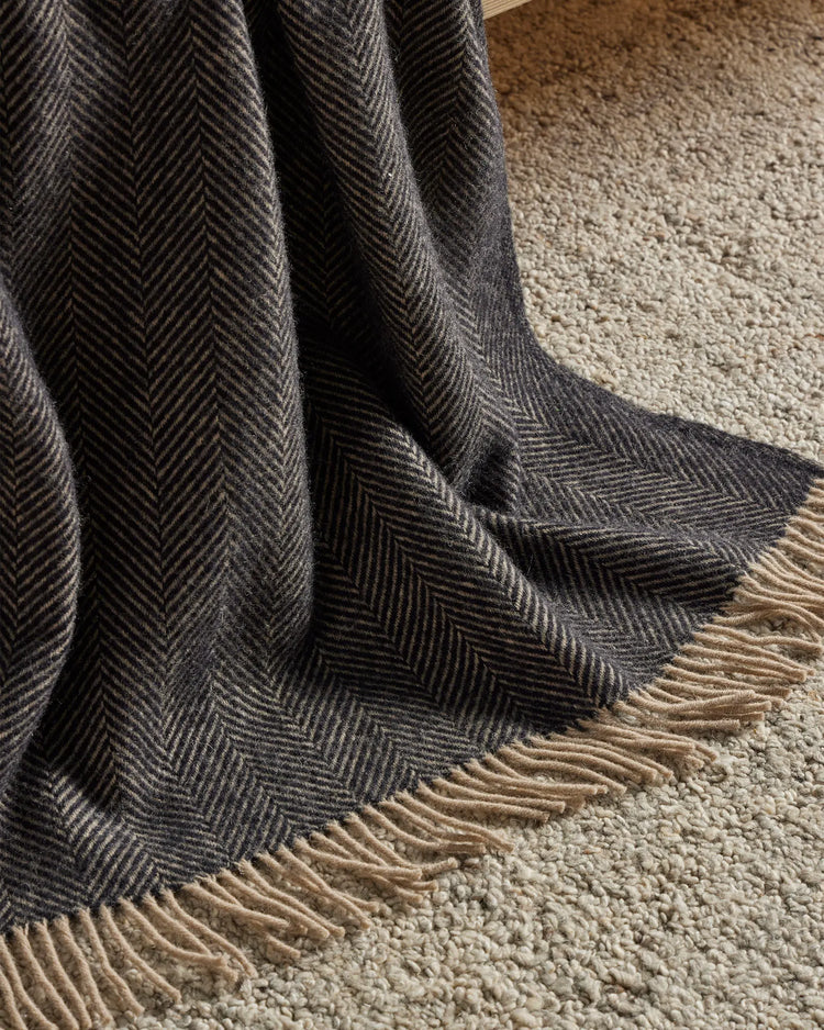 Marceau Taupe wool-blend rug detail, showing herringbone weave and natural fringe border by Weave Home