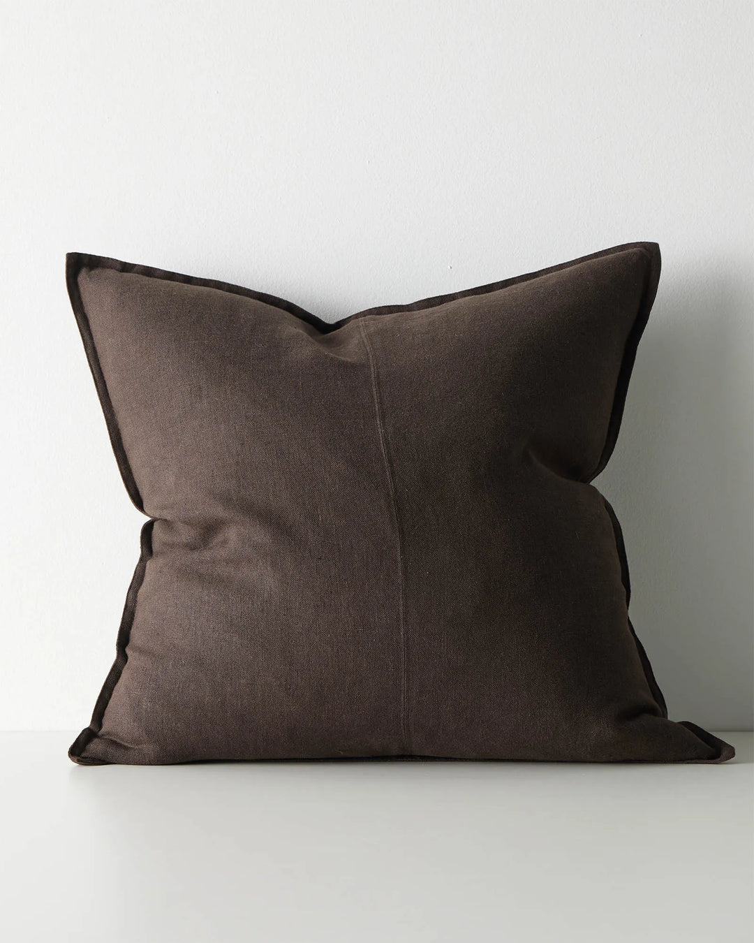 Como Ganache 60x60cm linen cushion in rich chocolate brown with contrasting dark piping, front view by Weave Home