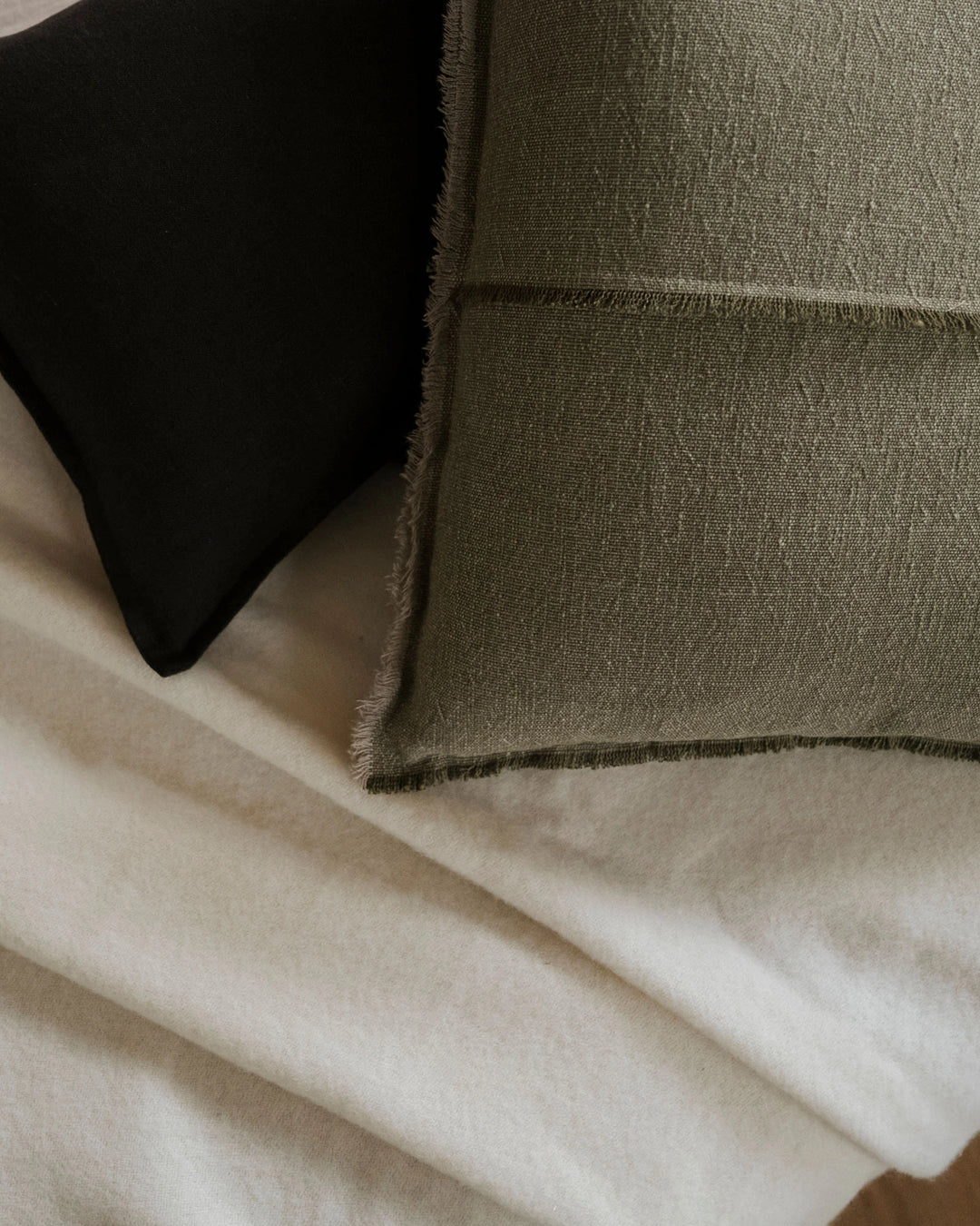 Como Ganache linen cushion in rich chocolate brown with raw edge fringe detail, by Weave Home