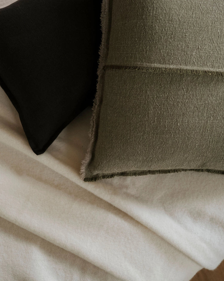 Como Ganache linen cushion in rich chocolate brown with raw edge fringe detail, by Weave Home