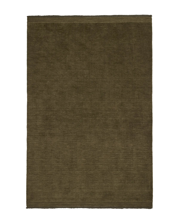 Silvio Oakmoss hand-woven rug in deep olive with micro fringe border detail by Weave Home