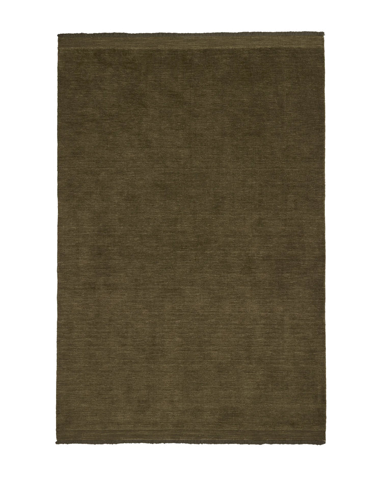 Silvio Oakmoss hand-woven rug in deep olive with micro fringe border detail by Weave Home