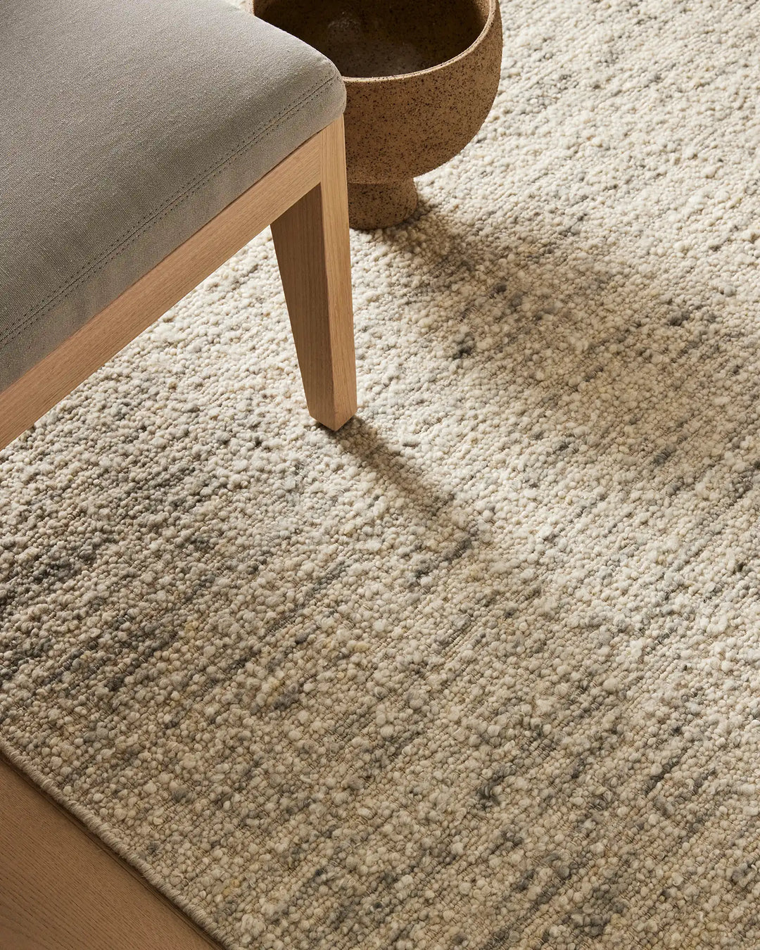 Henley Pelican bouclé rug in ivory with grey tones, showing textured wool weave and bound edge detail, by Weave Home