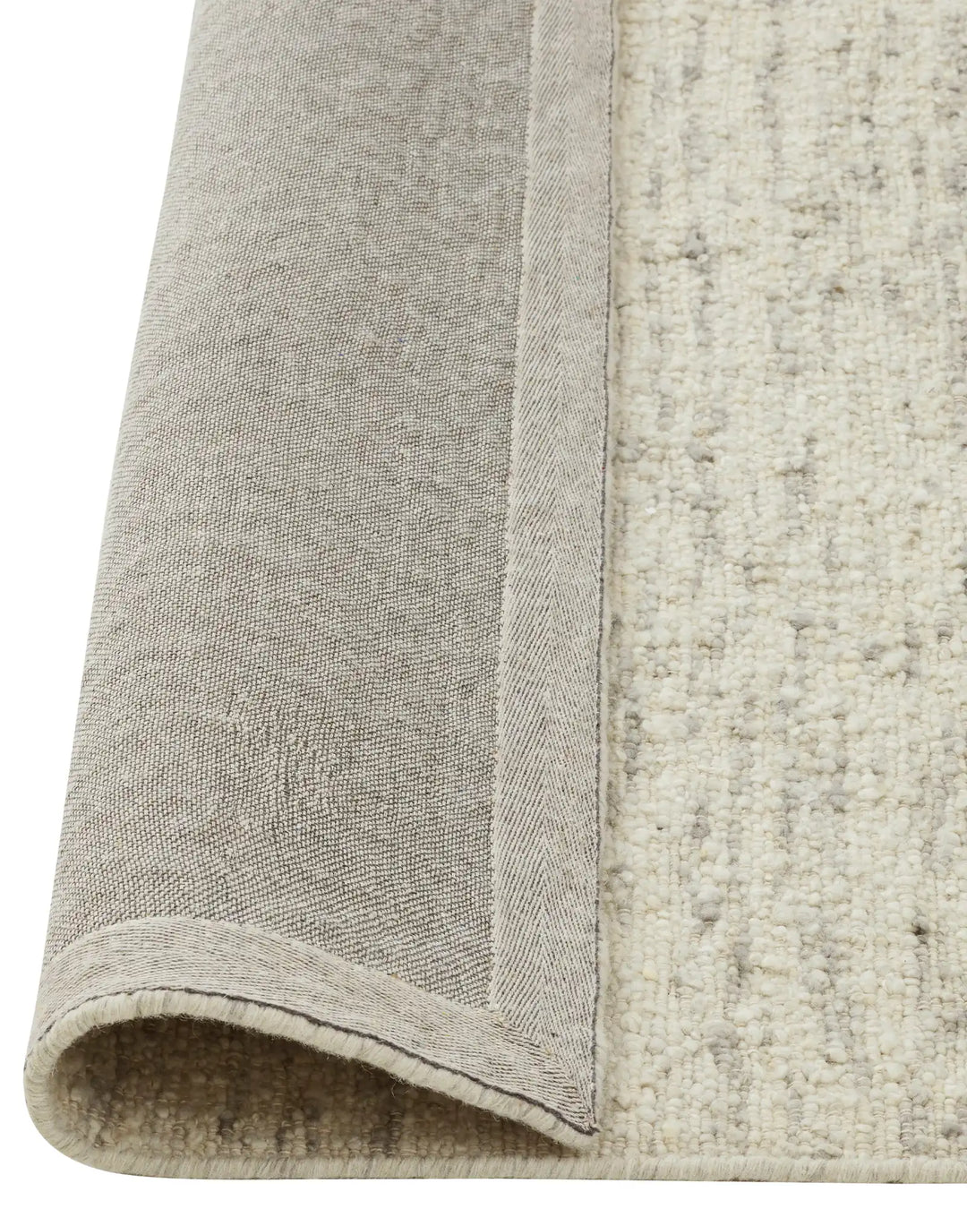 Henley Pelican rug backing detail, NZ wool bouclé weave in ivory with grey tones, bound edge visible by Weave Home