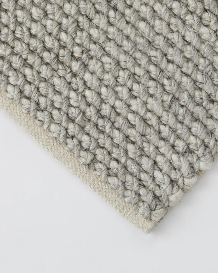 Emerson Feather rug detail, hand-woven NZ wool and viscose with chunky textured weave in cream and charcoal by Weave Home