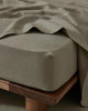 Ravello Fitted Sheet in Caper, European linen with thick elastic banding, corner detail view by Weave Home