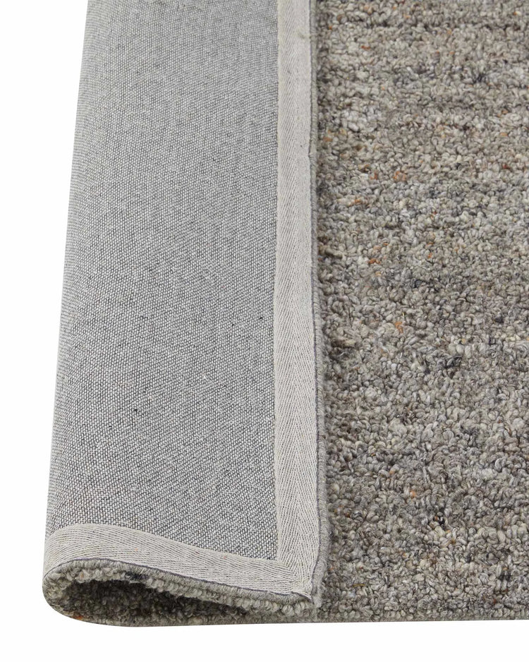 Marceau Shale rug detail, grey wool-blend high-traffic rug with bound edge and textured weave by Weave Home
