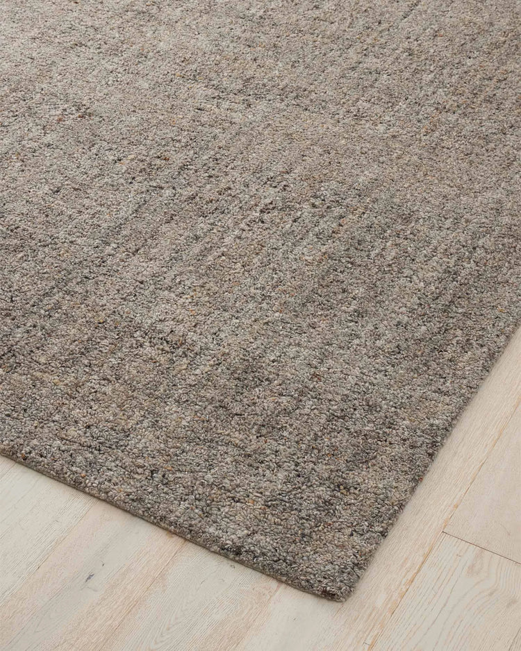 Marceau Shale wool-blend rug, corner view showing textured grey weave with light and dark threads, by Weave Home