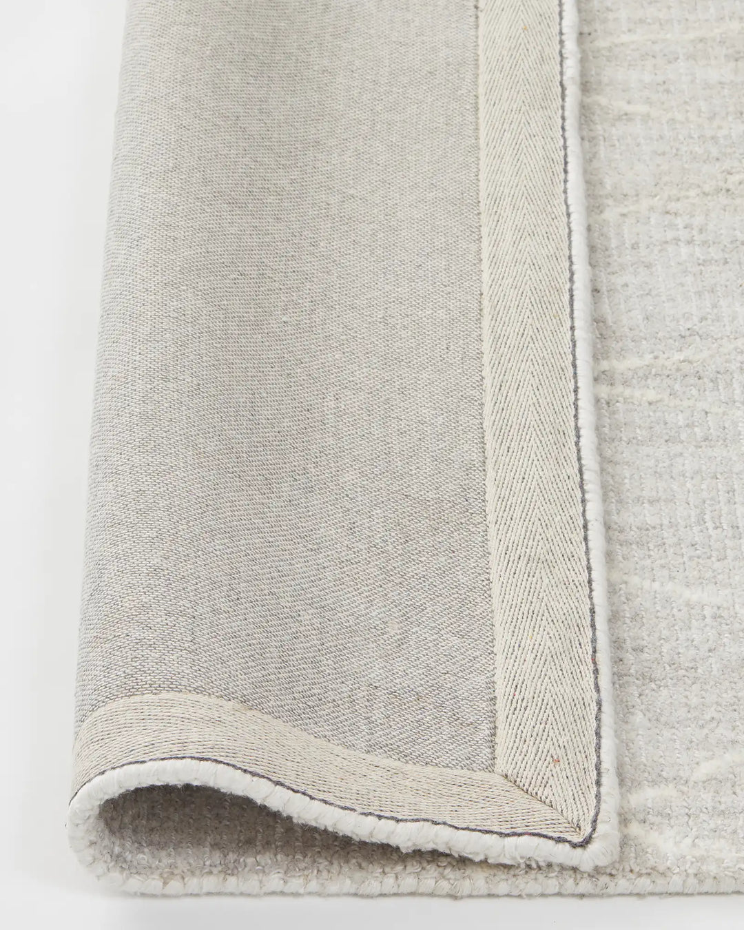 Katari Moon rug, close-up of textured viscose blend weave with cotton braided edge and backing by Weave Home