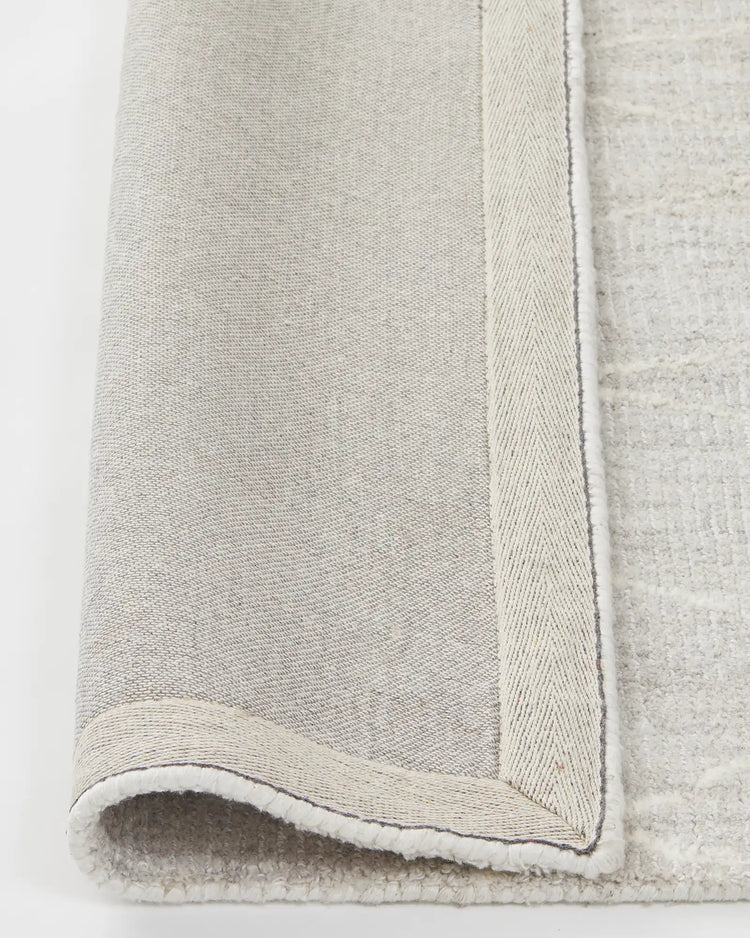 Katari Moon rug, close-up of textured viscose blend weave with cotton braided edge and backing by Weave Home