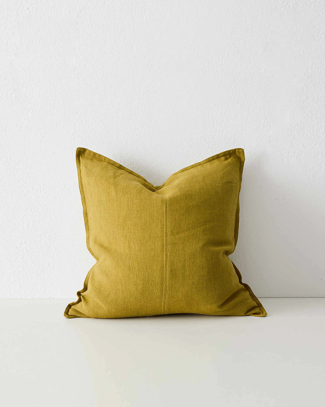 Como Moss linen cushion in mustard yellow with piping detail, front view by Weave Home