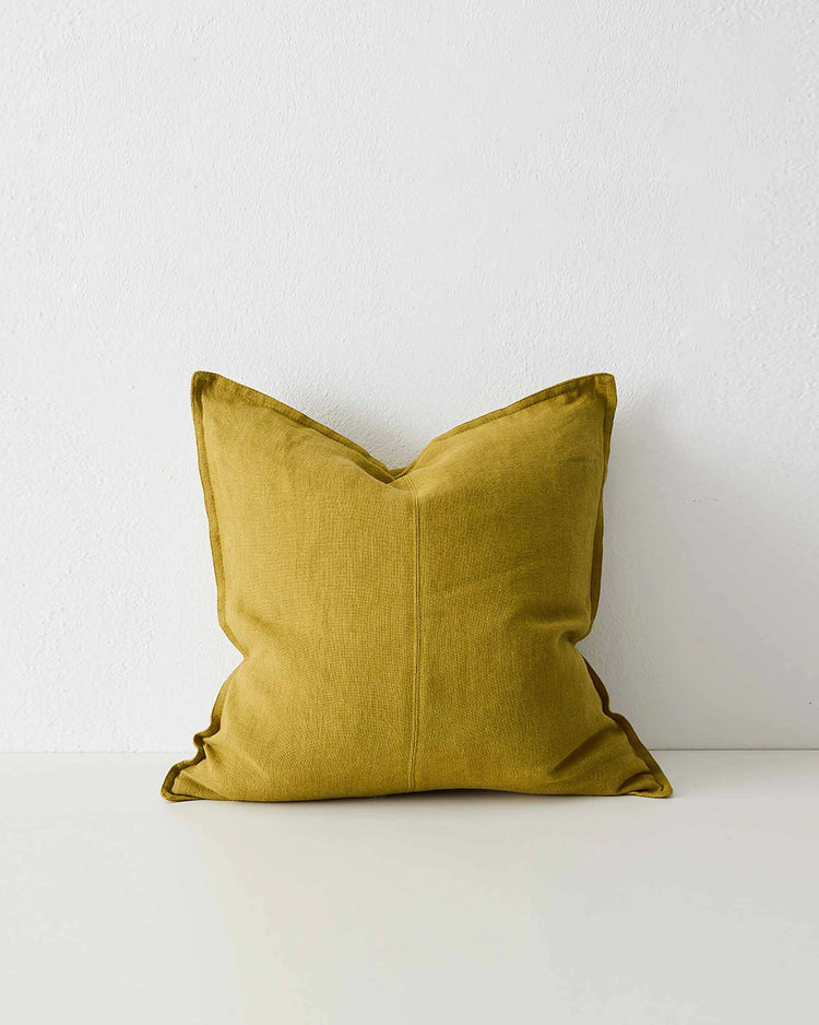 Como Moss linen cushion in mustard yellow with piping detail, front view by Weave Home