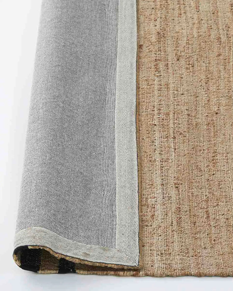 Umbra Natural jute rug detail showing flat weave texture and full cotton backing by Weave Home