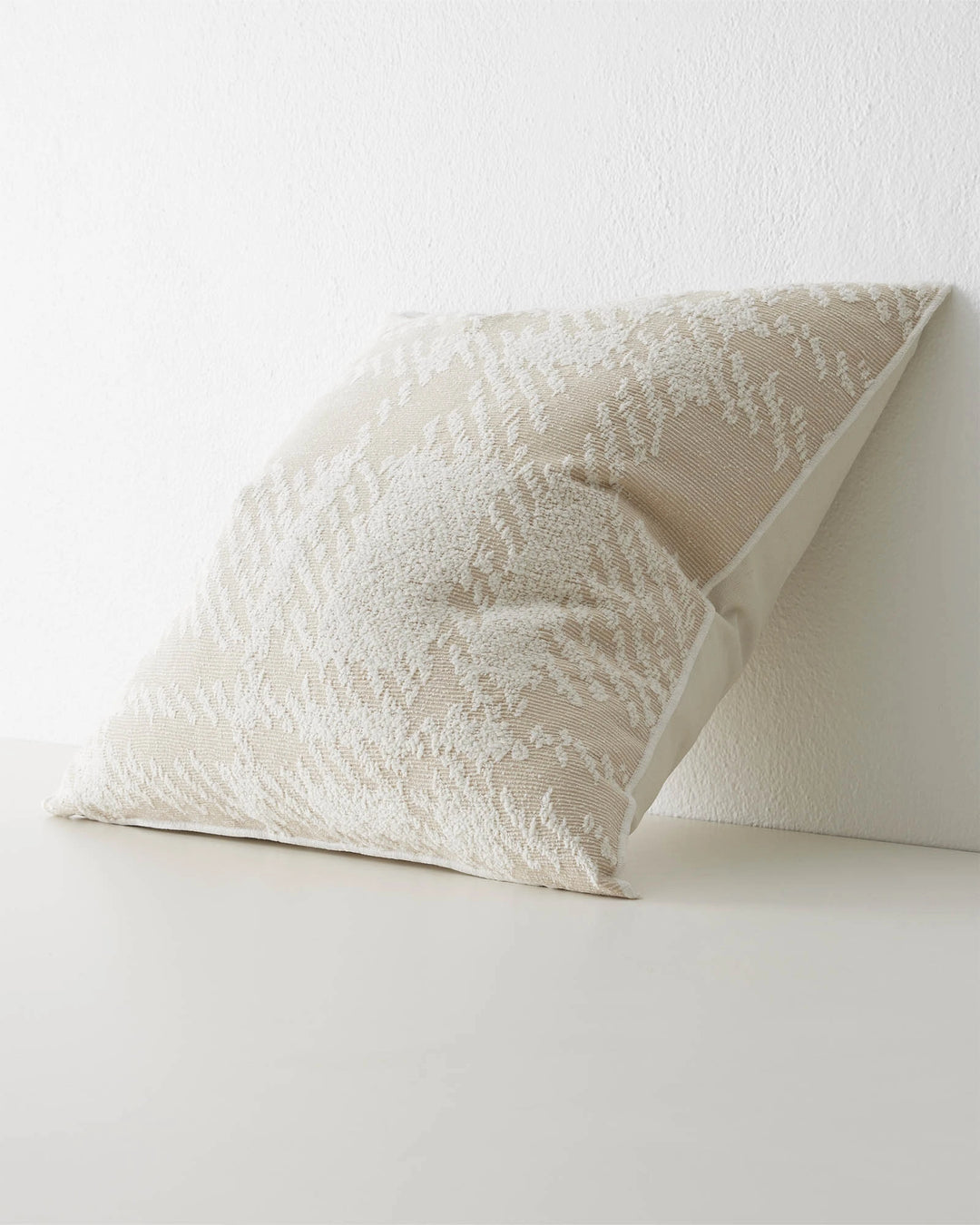 Sienne Macadamia 50x50 cushion in cream with oversized white check texture and overlocked edge by Weave Home