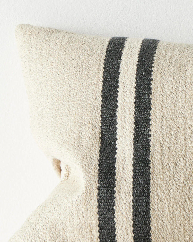 Mila Oyster lumbar cushion close-up, showing textured wool linen blend fabric with charcoal and cream striped detail by Weave Home