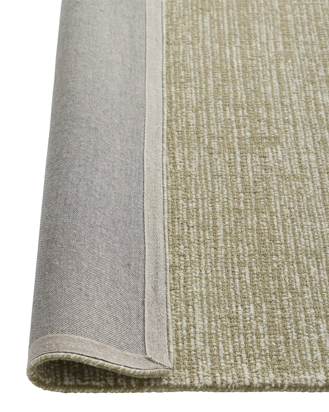 Kaia Willow rug detail showing contrast loop pile texture and bound edge in natural green NZ wool by Weave Home