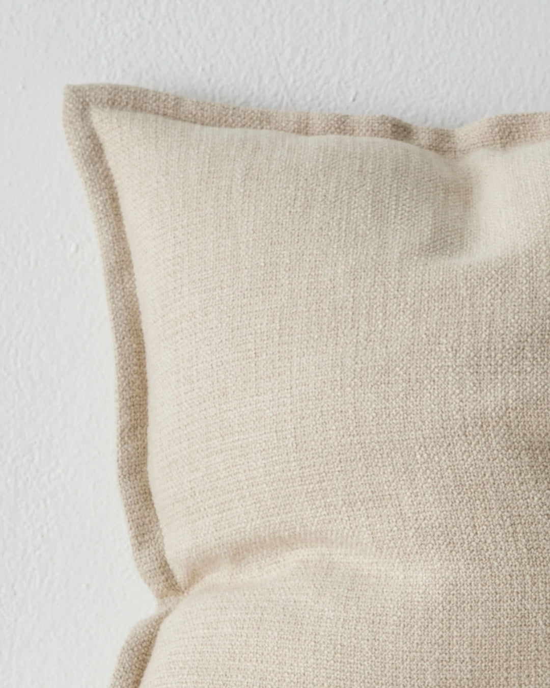 Figlio Oyster 50x50 cushion close-up, showing chunky woven texture and piped edge detail by Weave Home