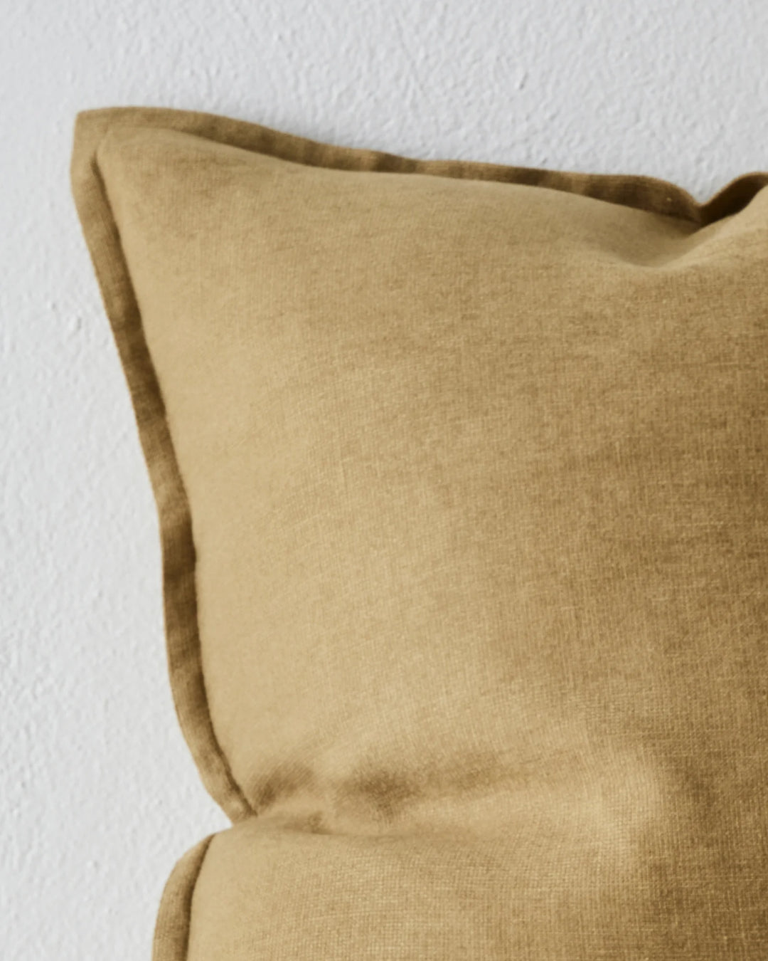 Fiore Sergeant lumbar cushion in olive linen viscose blend with soft piping detail, close-up view by Weave Home