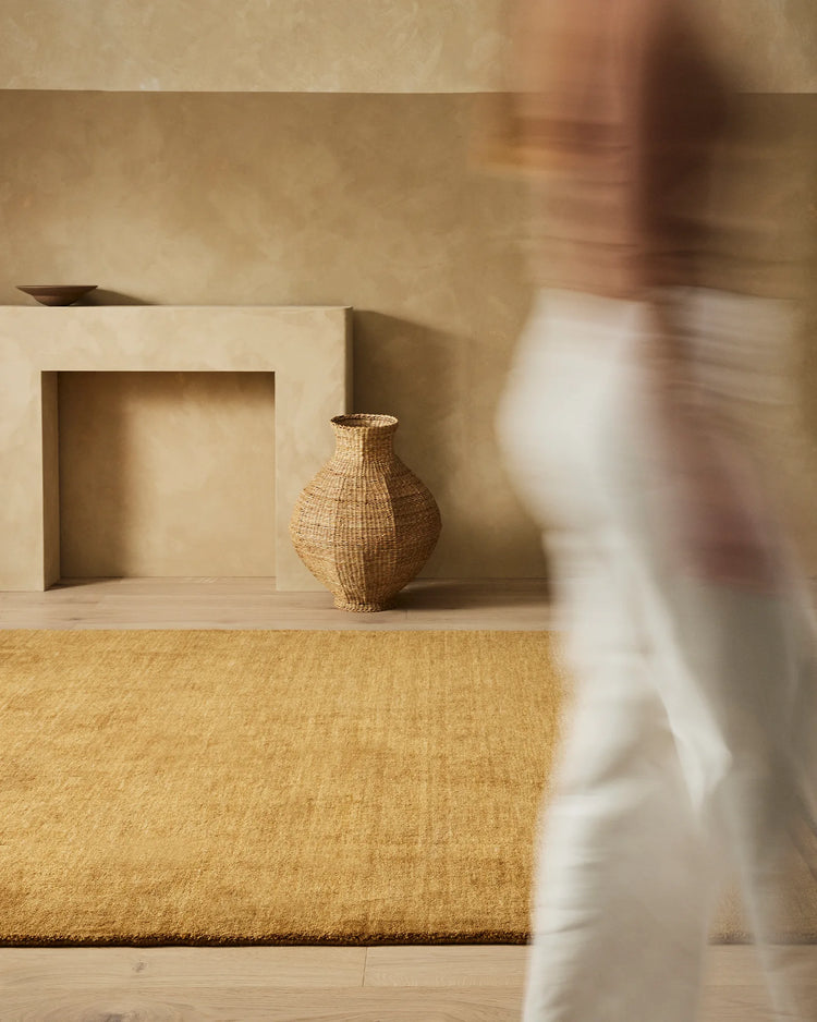 Silvio Dijon hand-woven rug in mustard yellow with micro fringe border, styled in living space by Weave Home