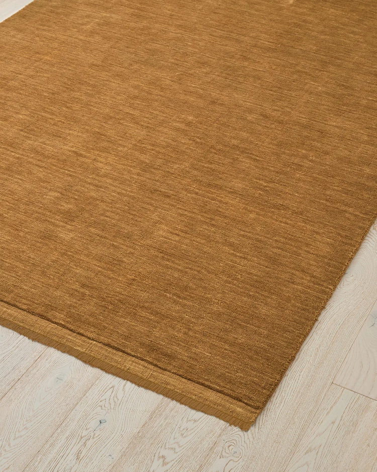 Silvio Dijon rug in mustard yellow, 3m x 4m, close-up corner detail showing micro fringe border and hand-woven texture by Weave Home