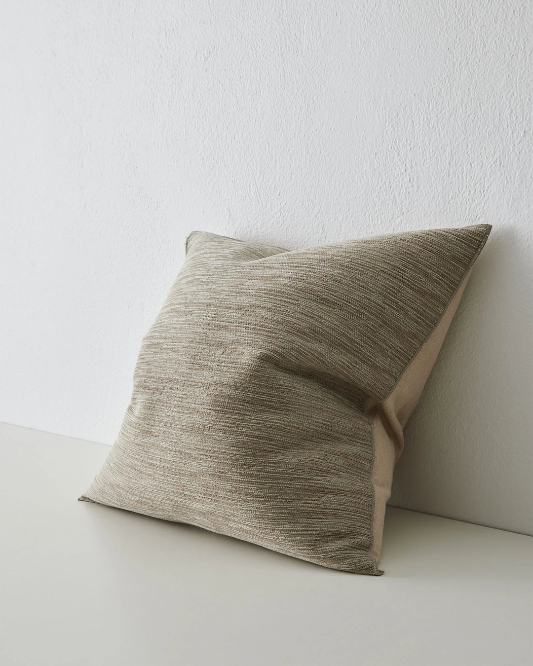 Dania Oyster 50x50 cushion with woven texture and warm two-toned finish, overlocked edge detail by Weave Home
