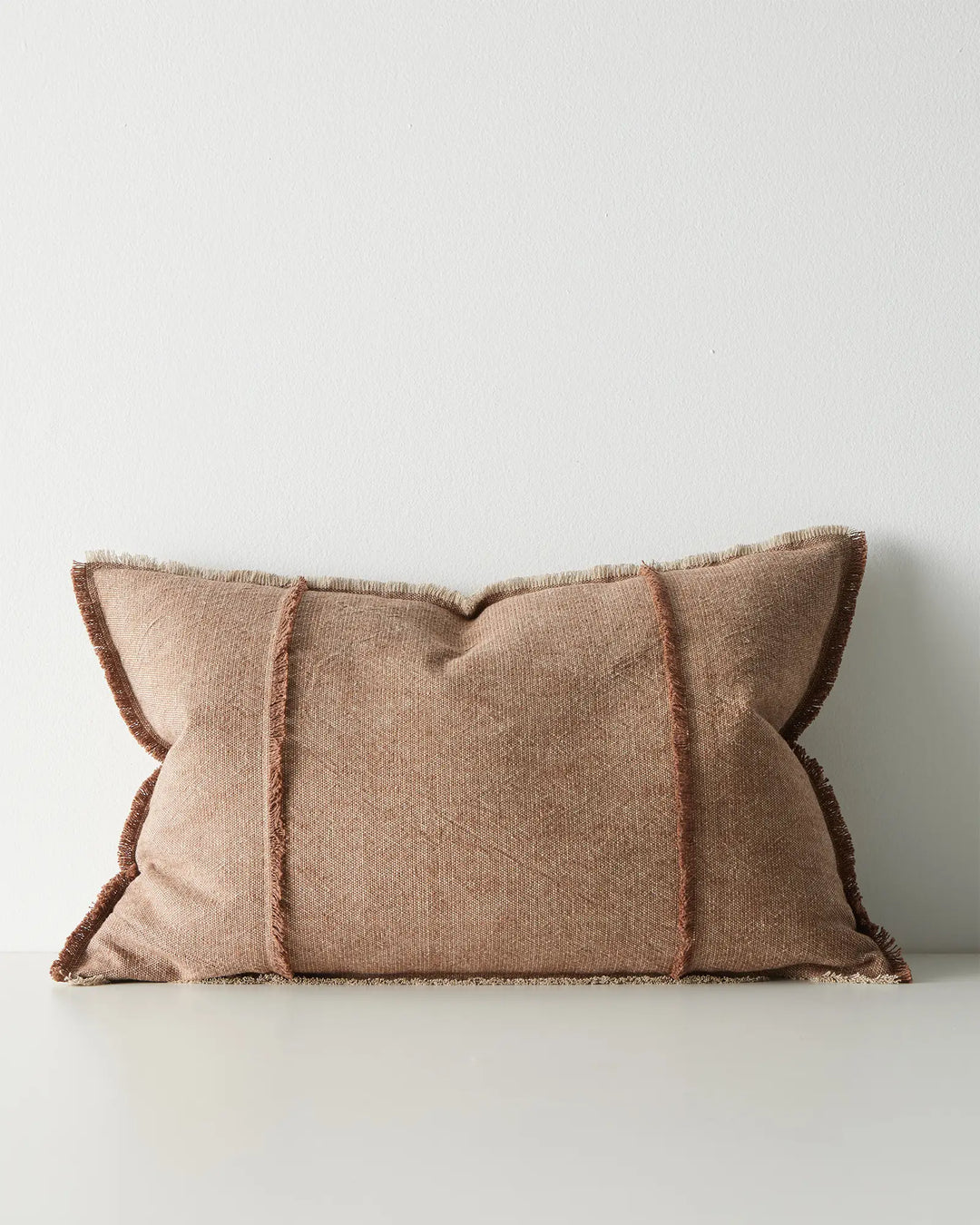 Adela Rust lumbar cushion, 40x60cm, cotton linen blend with two-tone woven texture and raw-edge fringe detail by Weave Home