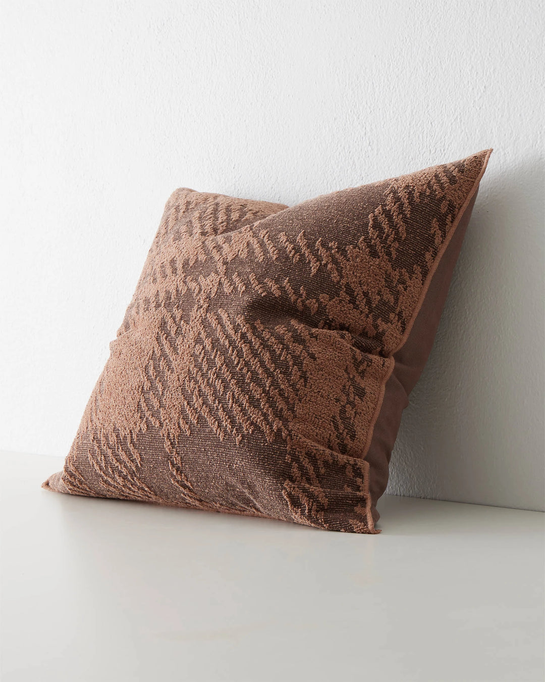 Sienne Earth 50x50 cushion, reddish-brown polyester-cotton blend with oversized check weave texture and overlocked edge, by Weave Home