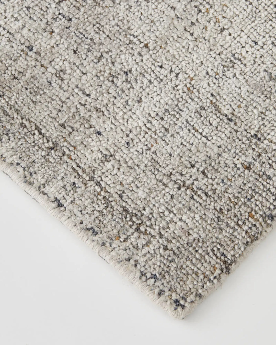 Matisse Shale rug detail, close-up of loom-knotted viscose blend with salt and pepper marled texture and cotton braided edge by Weave Home