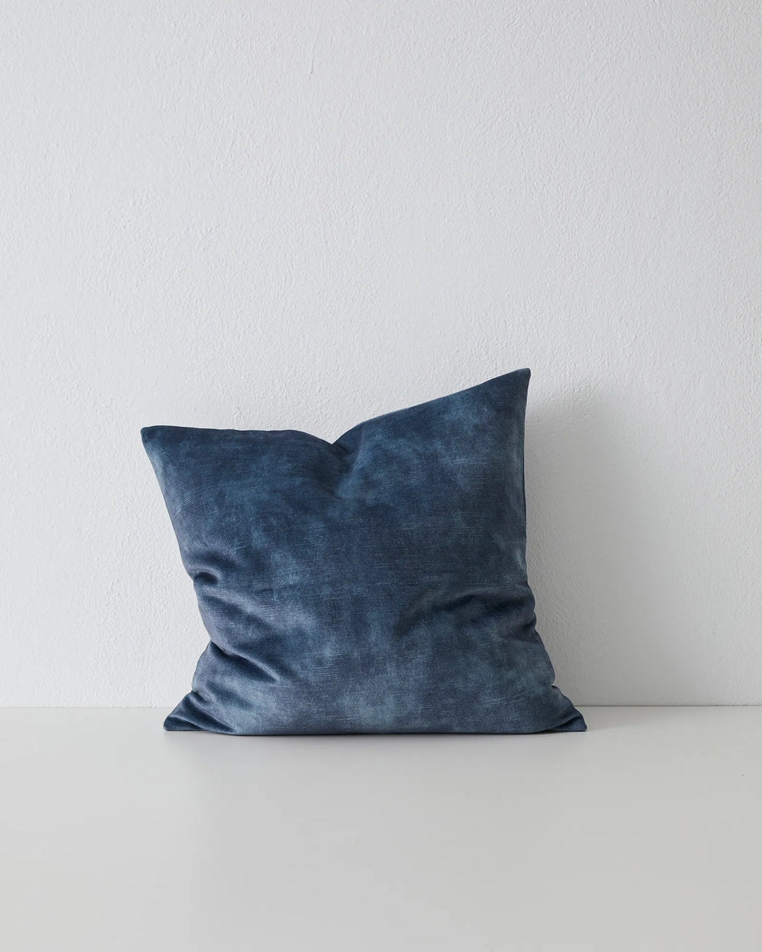 Ava Atlantic cushion, 50x50cm, in moody blue velvet-like polyester with relaxed drape and concealed zip by Weave Home