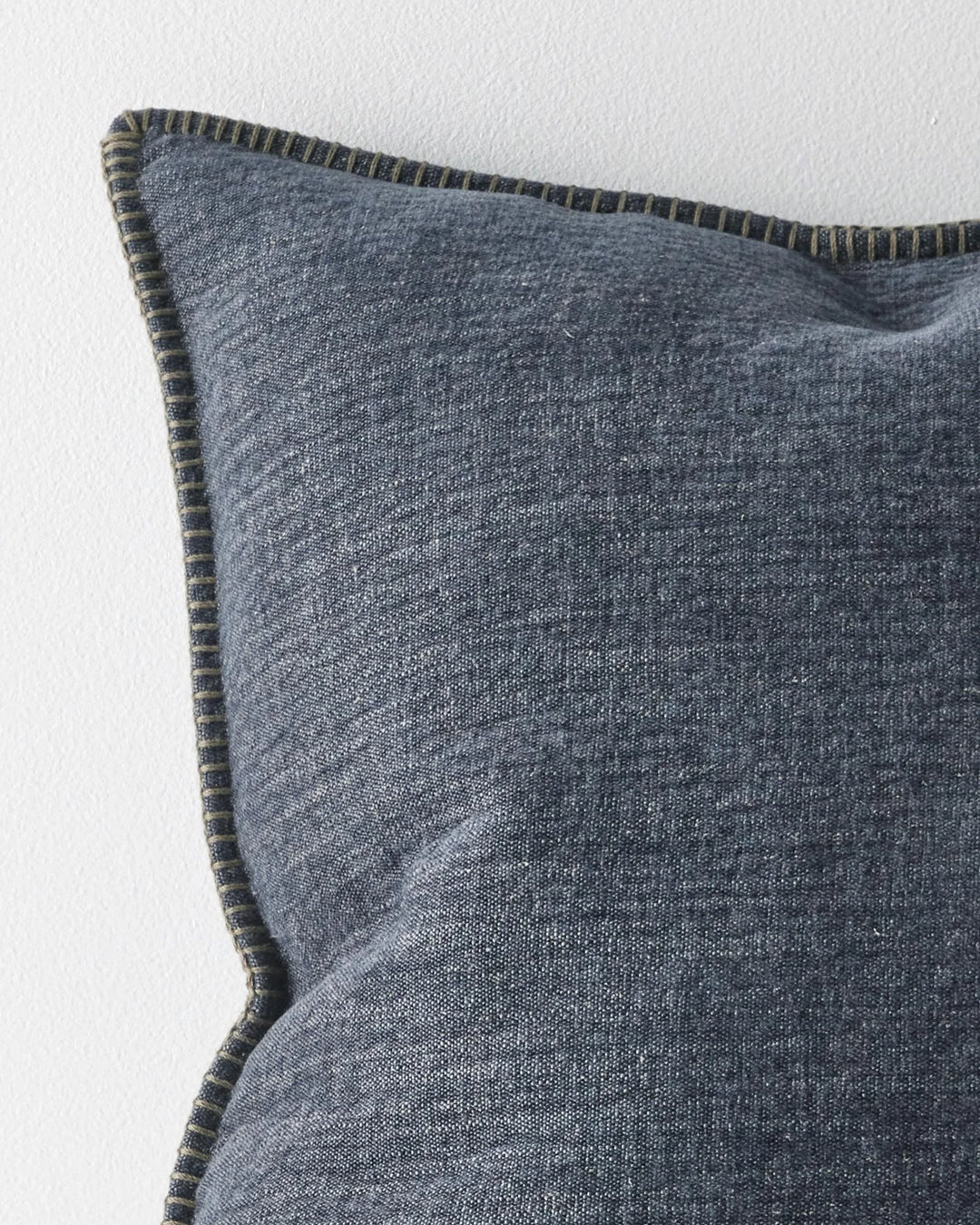 Alba Ocean 50x50 cushion in charcoal linen-polyester blend with navy undertones and blanket stitch edge detail by Weave Home