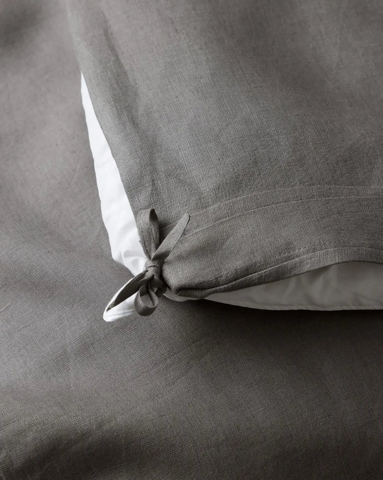 Ravello Quilt Cover Charcoal, detail of internal tie closure and white linen trim, by Weave Home