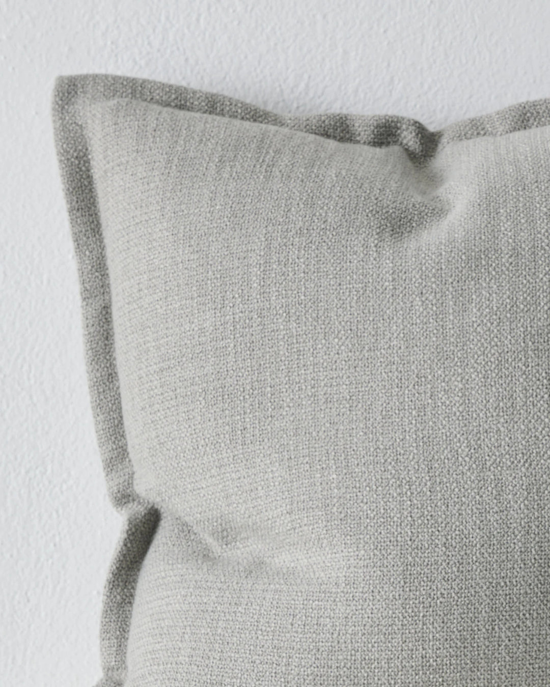 Figlio Mineral 50x50 cushion cover, close-up of soft grey woven polyester with rolled edge detail by Weave Home