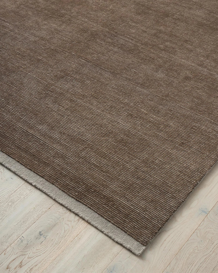 Remo Earth rug in chocolate and pewter striped wool with contrasting plain pewter border, detail view by Weave Home