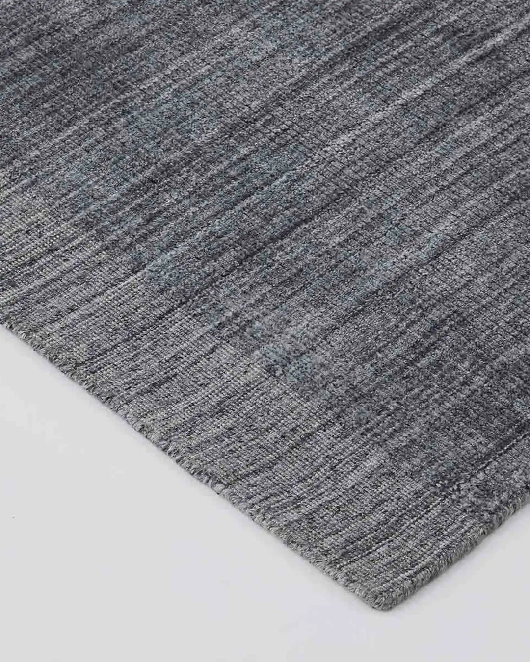 Travertine Pewter rug detail, showing hand-woven viscose blend texture with marbled appearance by Weave Home