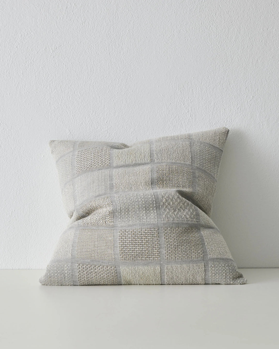 Bodrum Mist 50x50 linen cushion in soft blue-grey, featuring geometric checkerboard with mixed weave panels by Weave Home