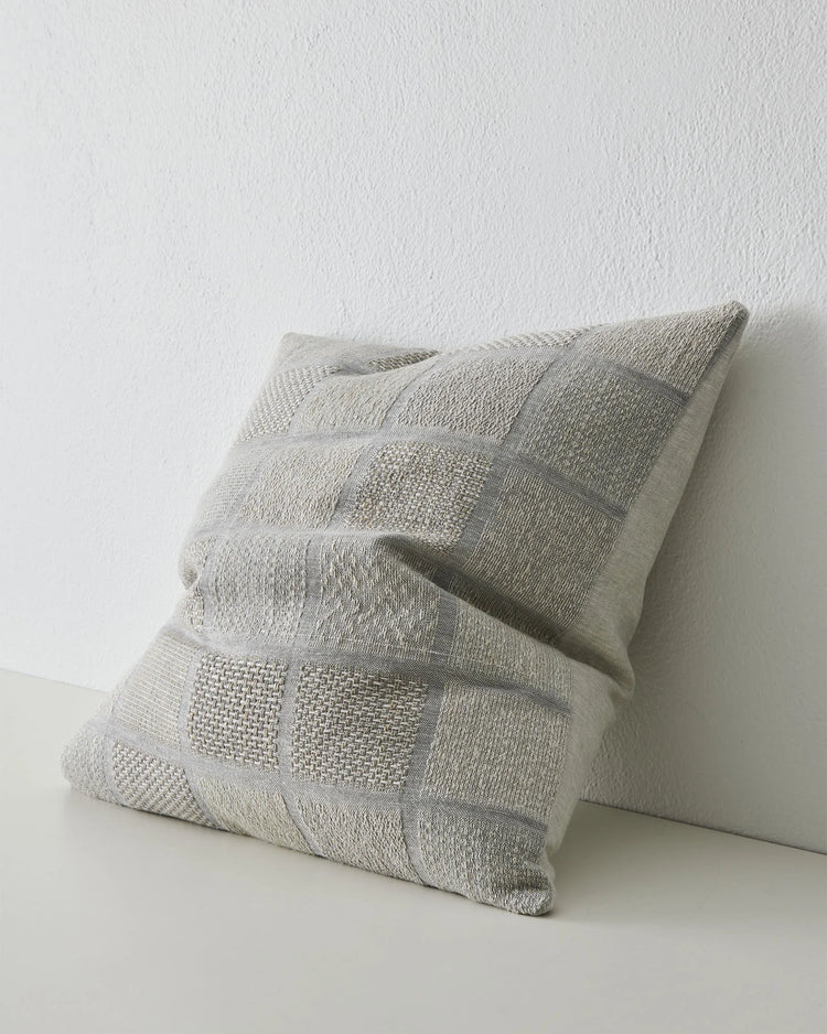 Bodrum Mist 50x50 linen cushion cover in soft blue, featuring woven checkerboard panels with varied weave textures by Weave Home