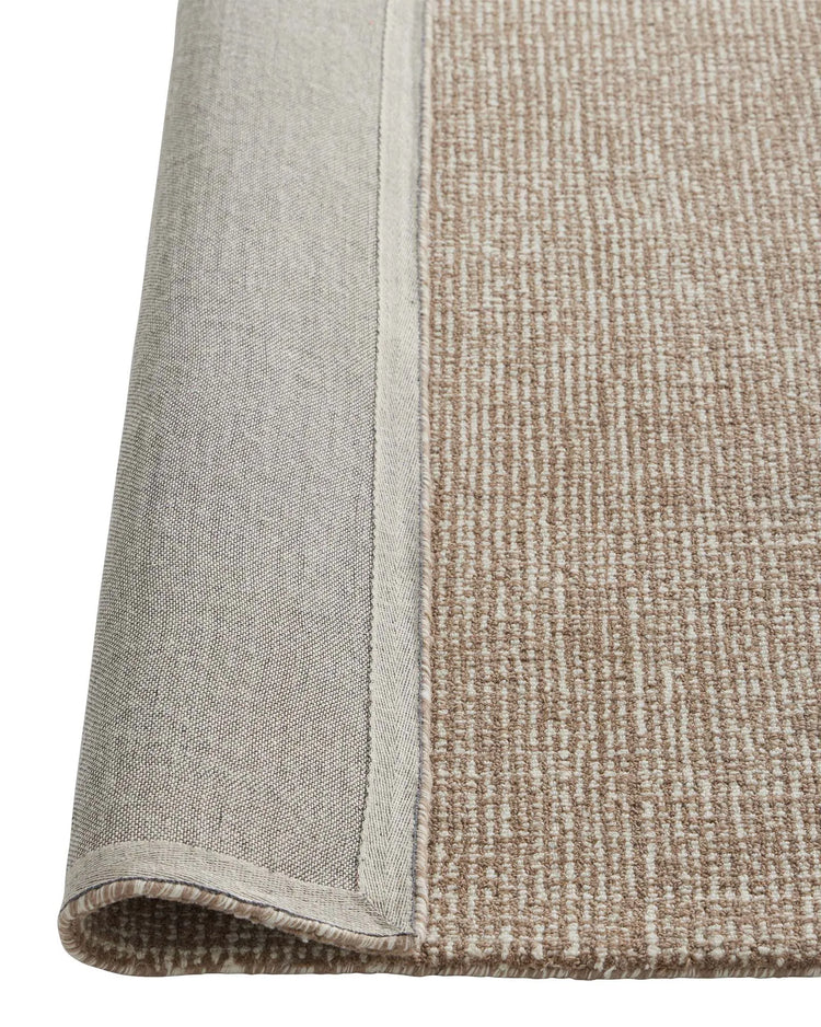 Kaia Mocha rug detail view, showing textured NZ wool weave with contrasting beige binding and two-tone effect by Weave Home