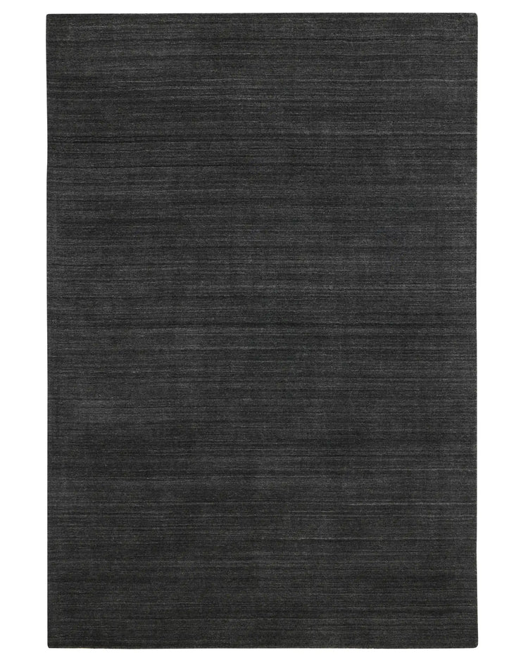 Gippsland Alloy hand-woven rug in dark charcoal with grey-silver highlights, 2m x 3m viscose-wool blend, cotton braided edge by Weave Home