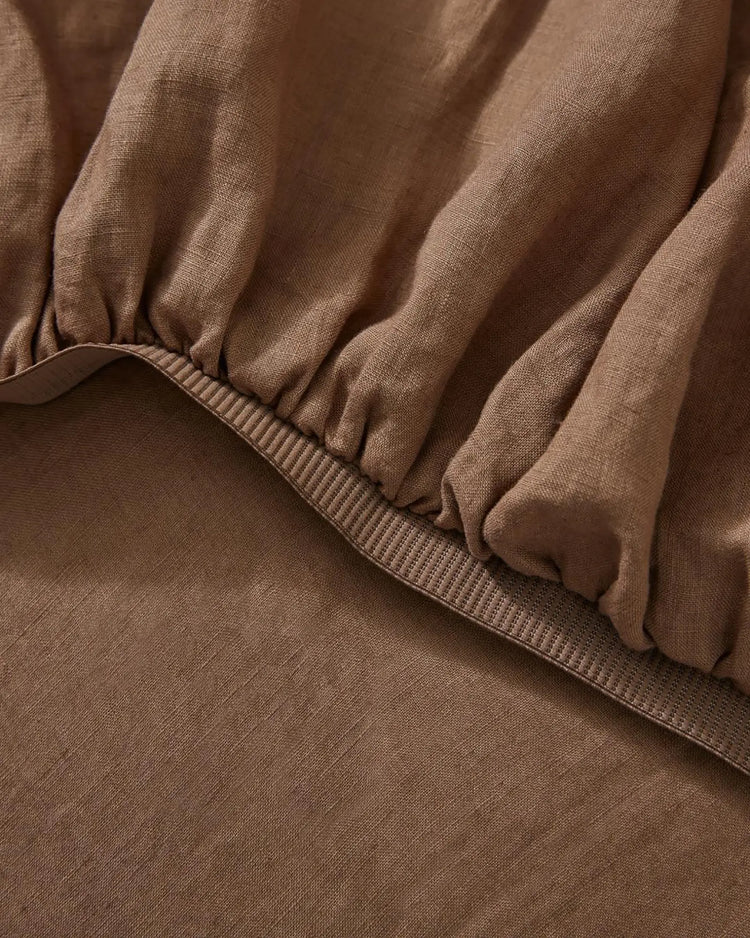 Ravello Fitted Sheet in Biscuit, close-up of elastic edge and ribbed binding detail by Weave Home