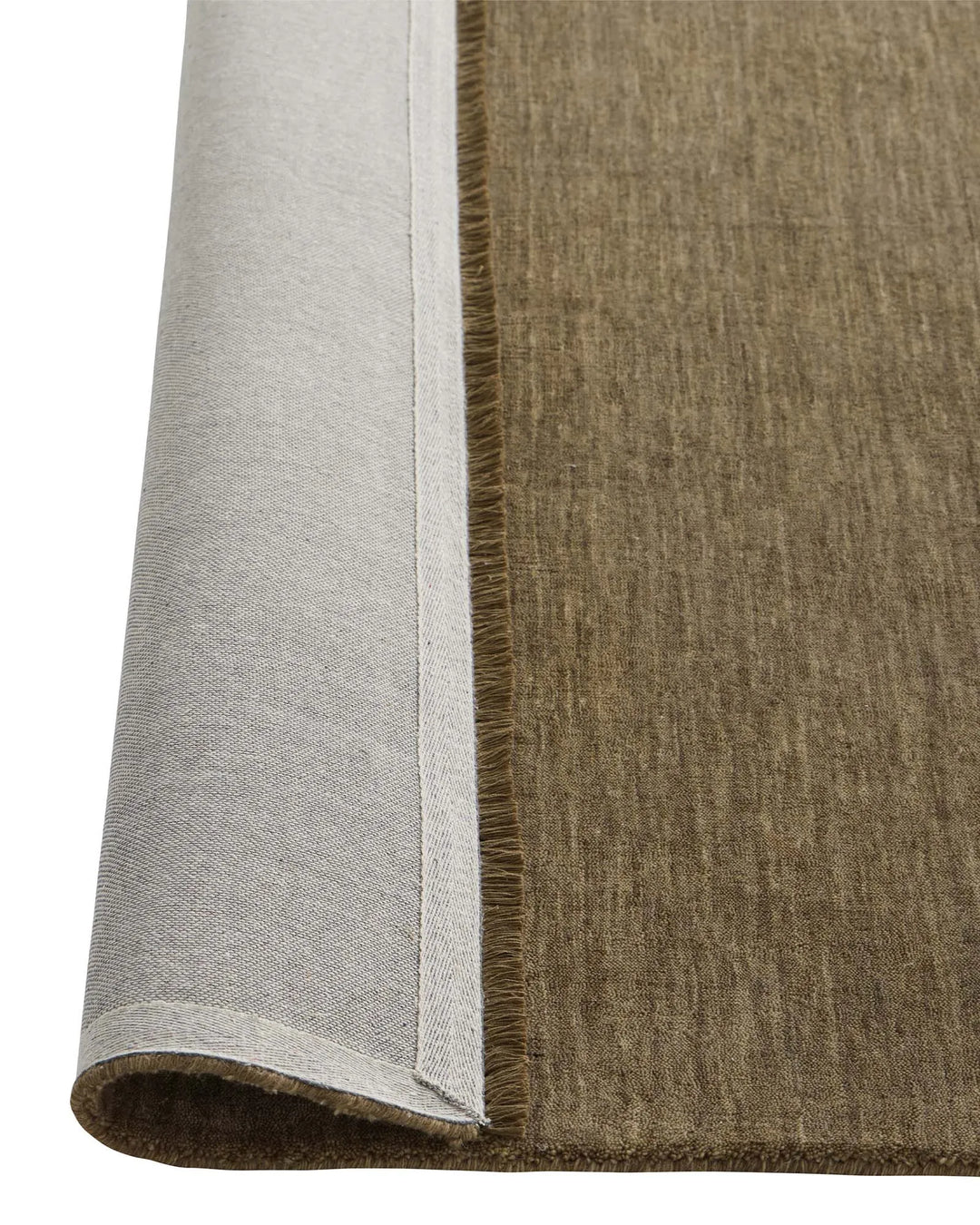 Silvio Walnut rug detail showing micro fringe border and rolled edge in walnut brown with olive undertones by Weave Home