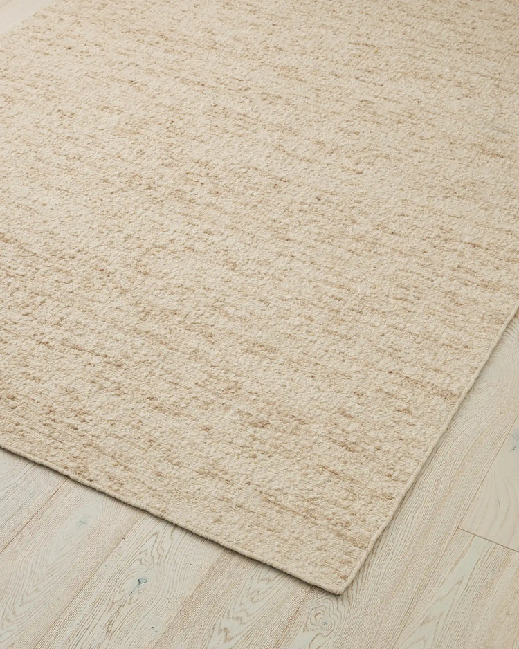 Henley Ivory bouclé wool rug, 2x3m, close-up showing nubby woven texture and bound edge detail by Weave Home